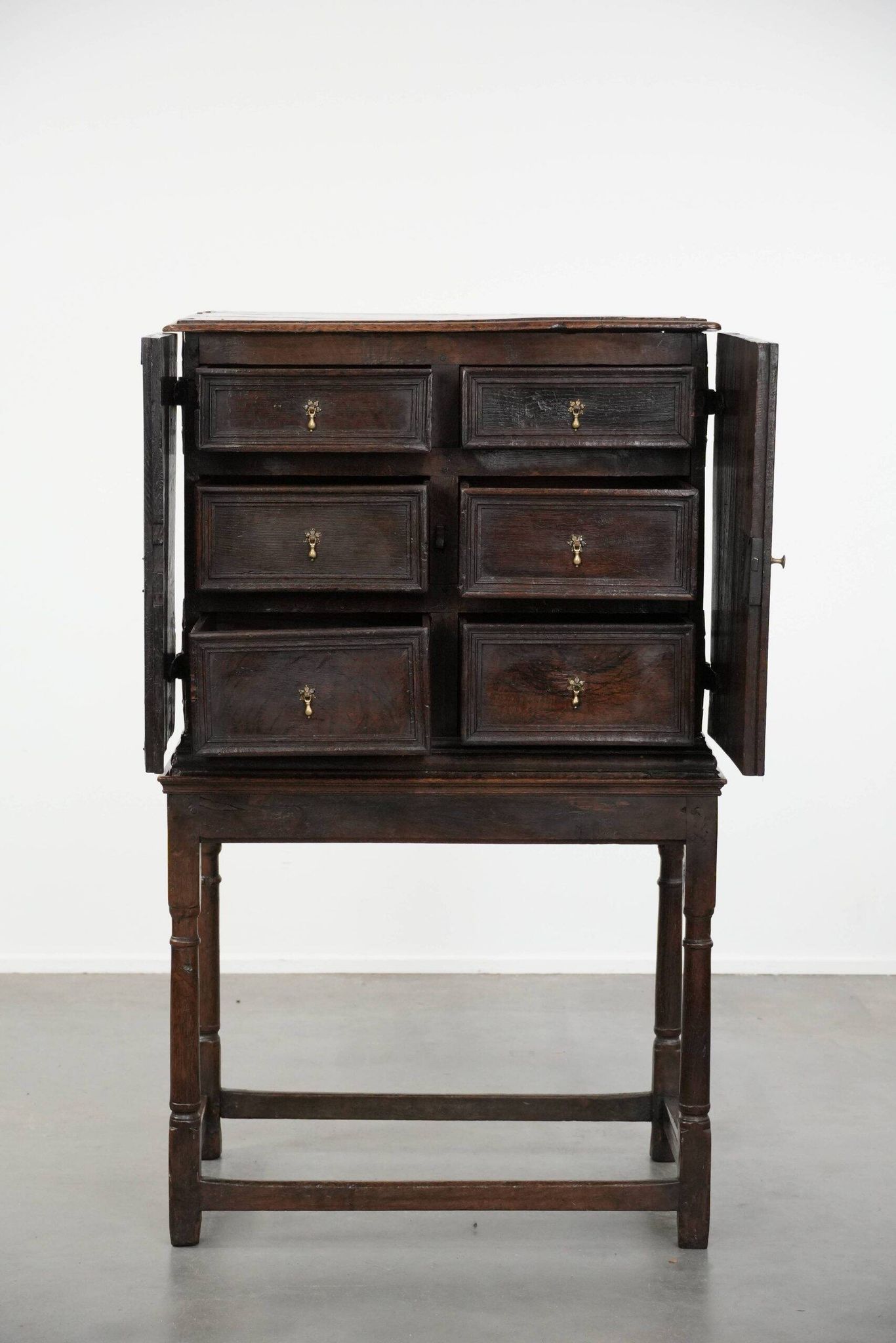 Unique antique English cabinet on stand made of oak from the 17th century