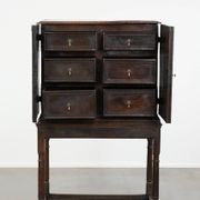 Unique antique English cabinet on stand made of oak from the 17th century