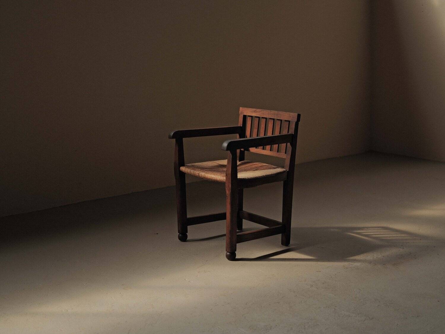 Handcrafted oak and straw armchair, France, circa 1950.