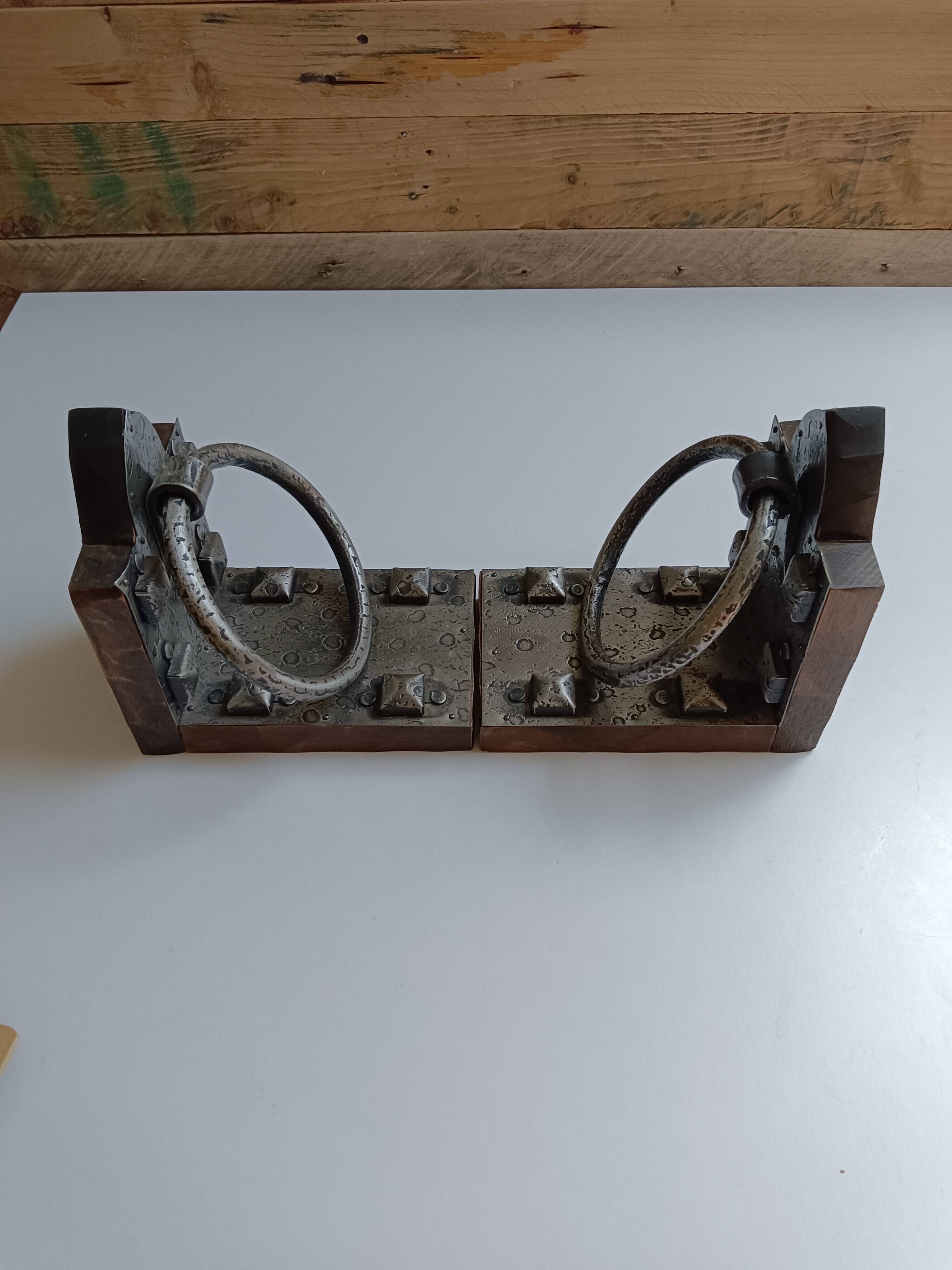 Medieval-style bookends, antique door handle.