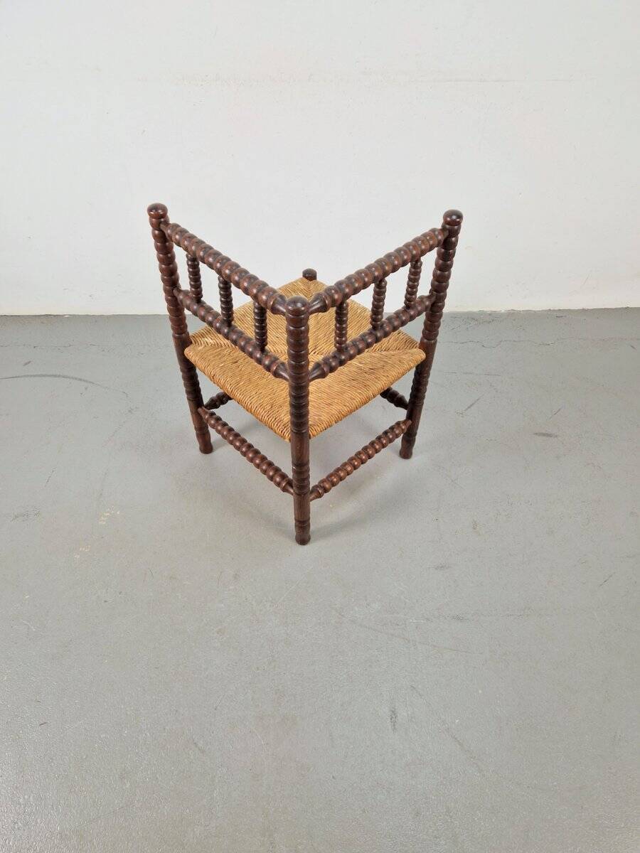 Corner chair in Arts and Crafts style made of oak with a rush seat, 1950s.