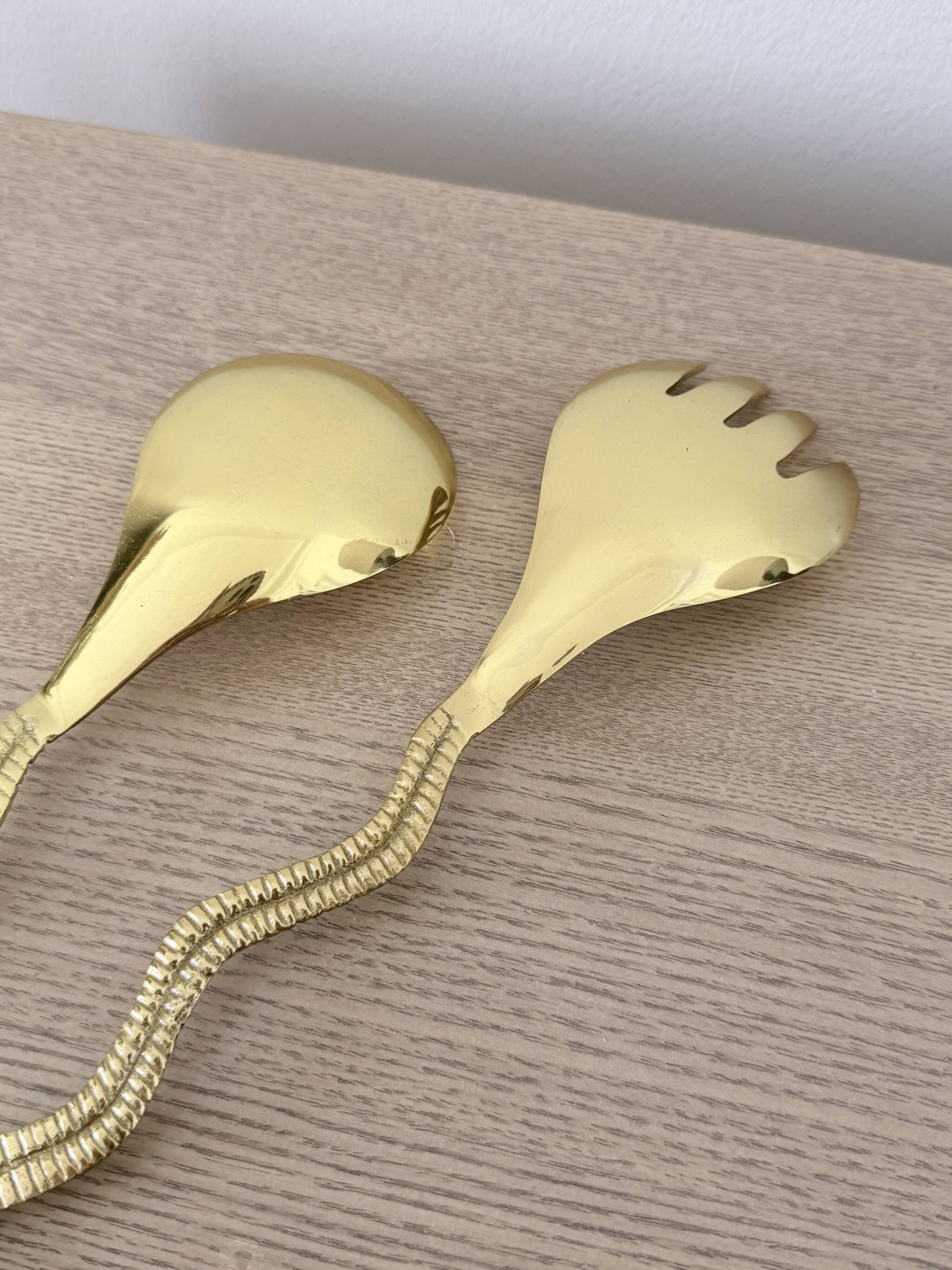 Gold metal snake salad serving set