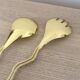 Gold metal snake salad serving set