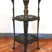 Italian side table with three openwork shelves in patinated metal.