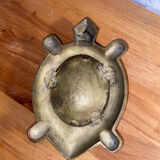 Empty brass turtle pocket
