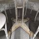 Antique painted wrought iron garden furniture, round table and four chairs.