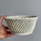 Bread basket - openwork white ceramic bowl.