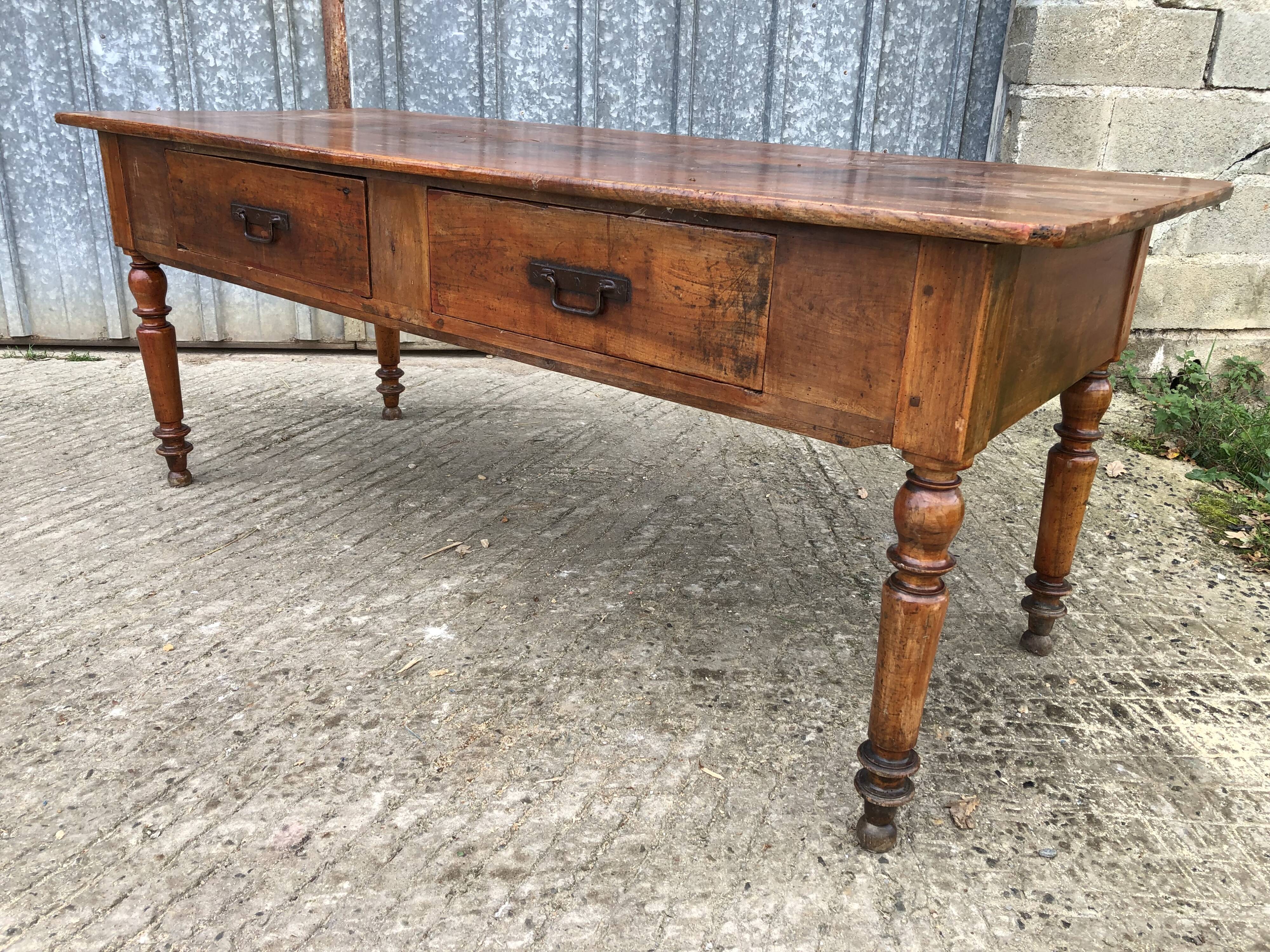 Old farmhouse table in solid cherry wood with 2 front drawers.