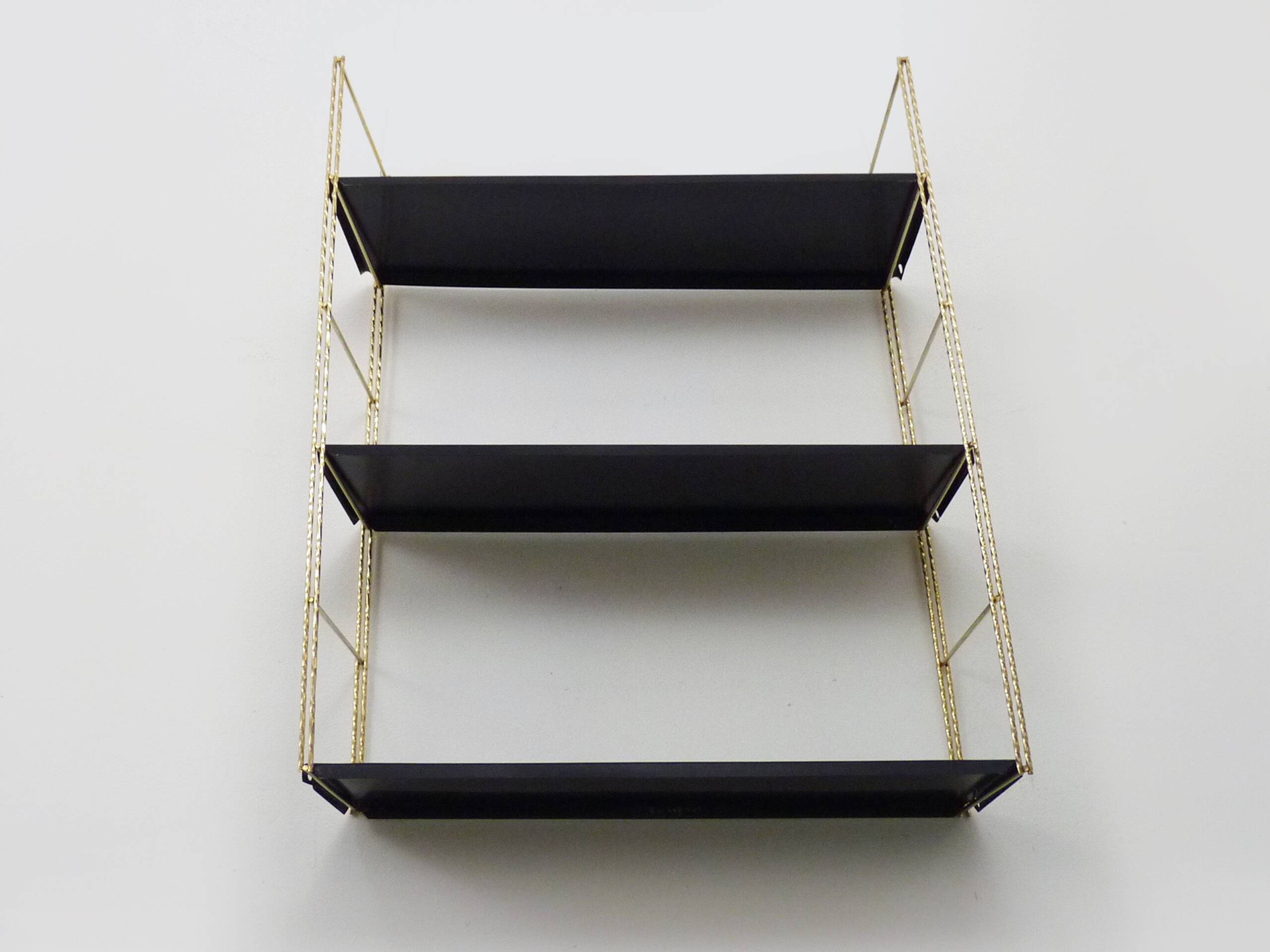 Vintage black and gold String design shelf. 60s