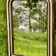 Louis Philippe mirror, wood and stucco with faux wood decoration. 19th century. 56 x 74.