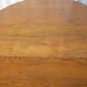 1930s oak dining table, slightly oval.
