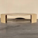 Large designer coffee table in travertine, eye shape, Roche Bobois edition from the 80s
