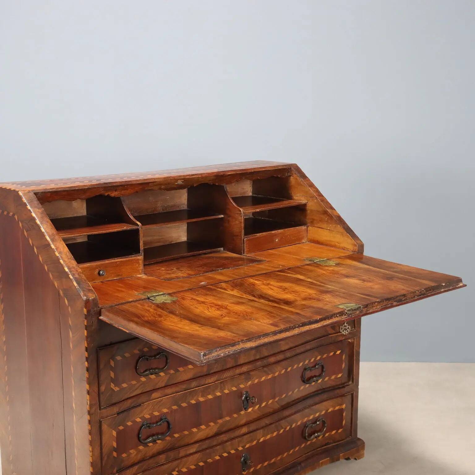 Antique drop-leaf cabinet in various types of wood, Italy, 18th century.