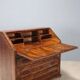 Antique drop-leaf cabinet in various types of wood, Italy, 18th century.