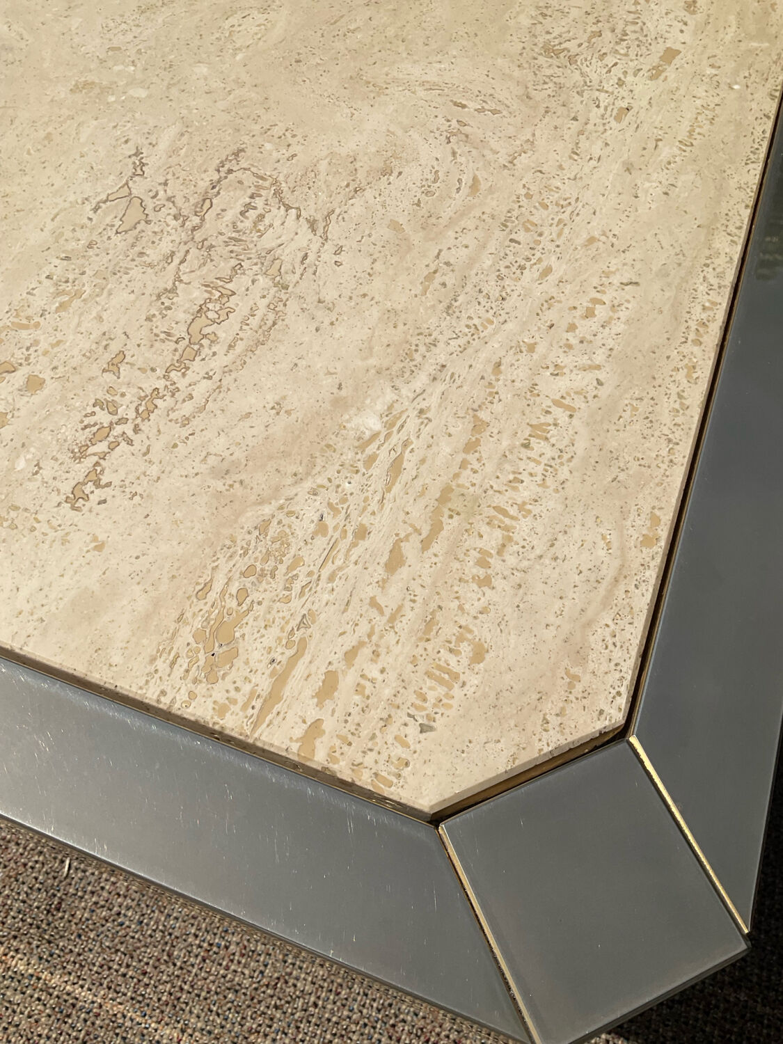 Vintage coffee table in travertine and brass.