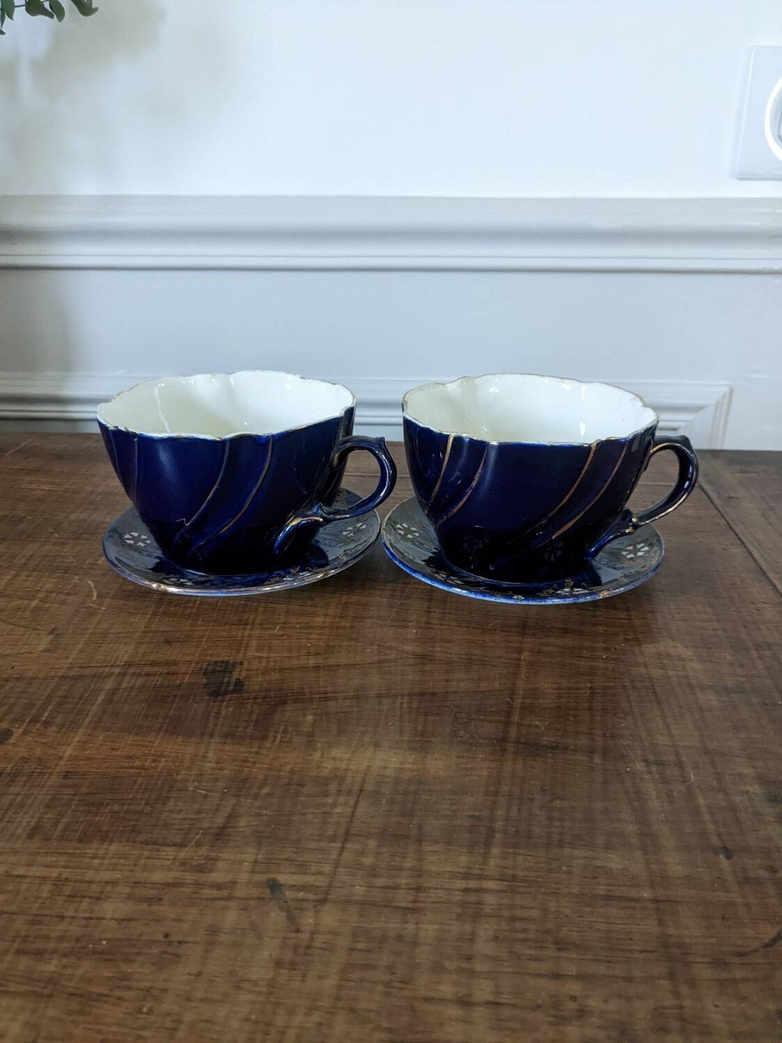 Set of two large Lunéville cups and saucers