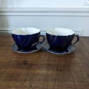 Set of two large Lunéville cups and saucers