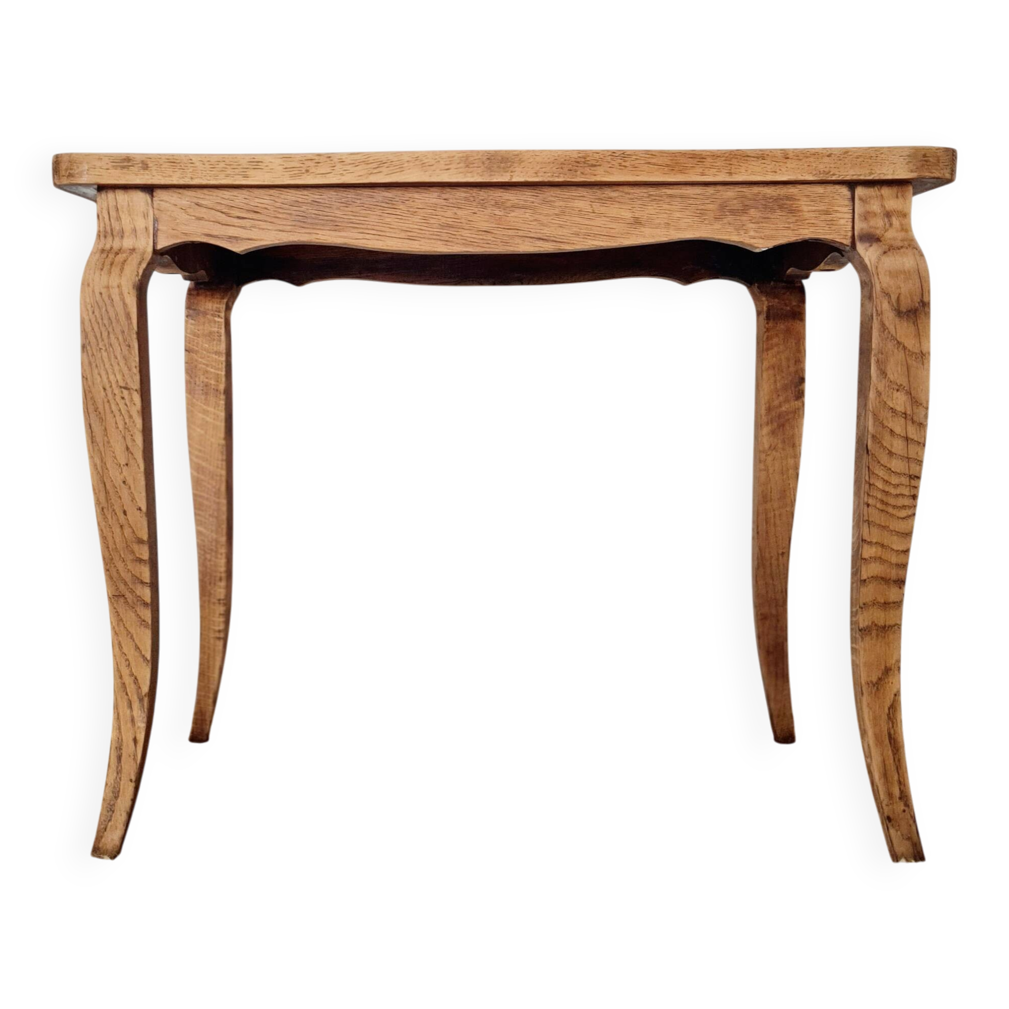 Antique coffee table with curved legs.