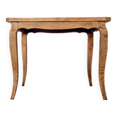 Antique coffee table with curved legs.
