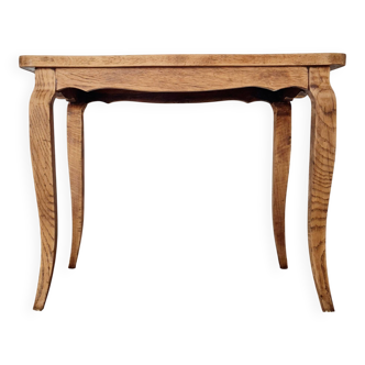 Antique coffee table with curved legs.