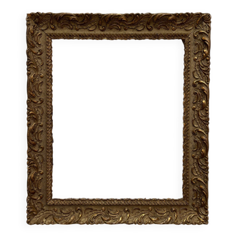 Old frame in gilded wood with stucco decoration circa 1900