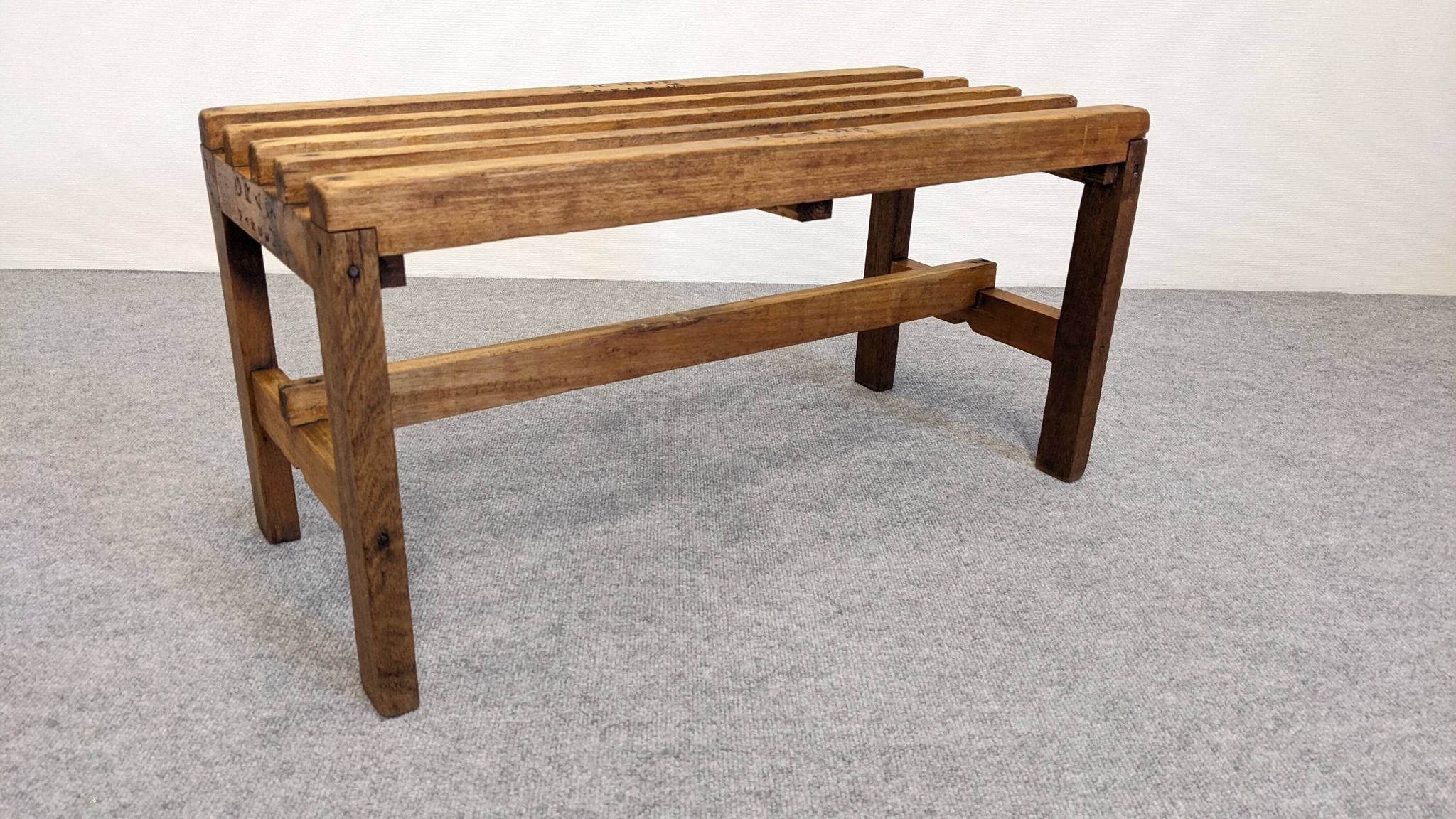 Wooden slatted display bench or support, France circa 1960.