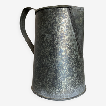 Old garden pitcher vase in folded zinc