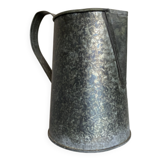 Old garden pitcher vase in folded zinc