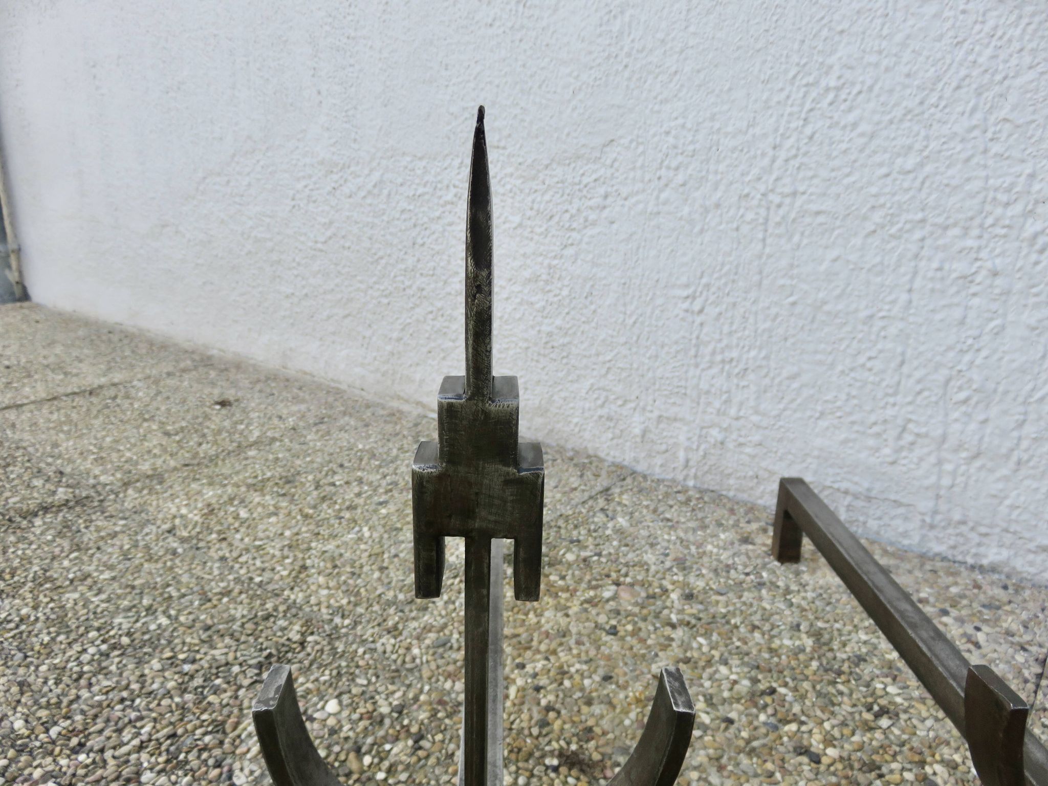 Pair of modernist andirons in forged and hammered steel, French work