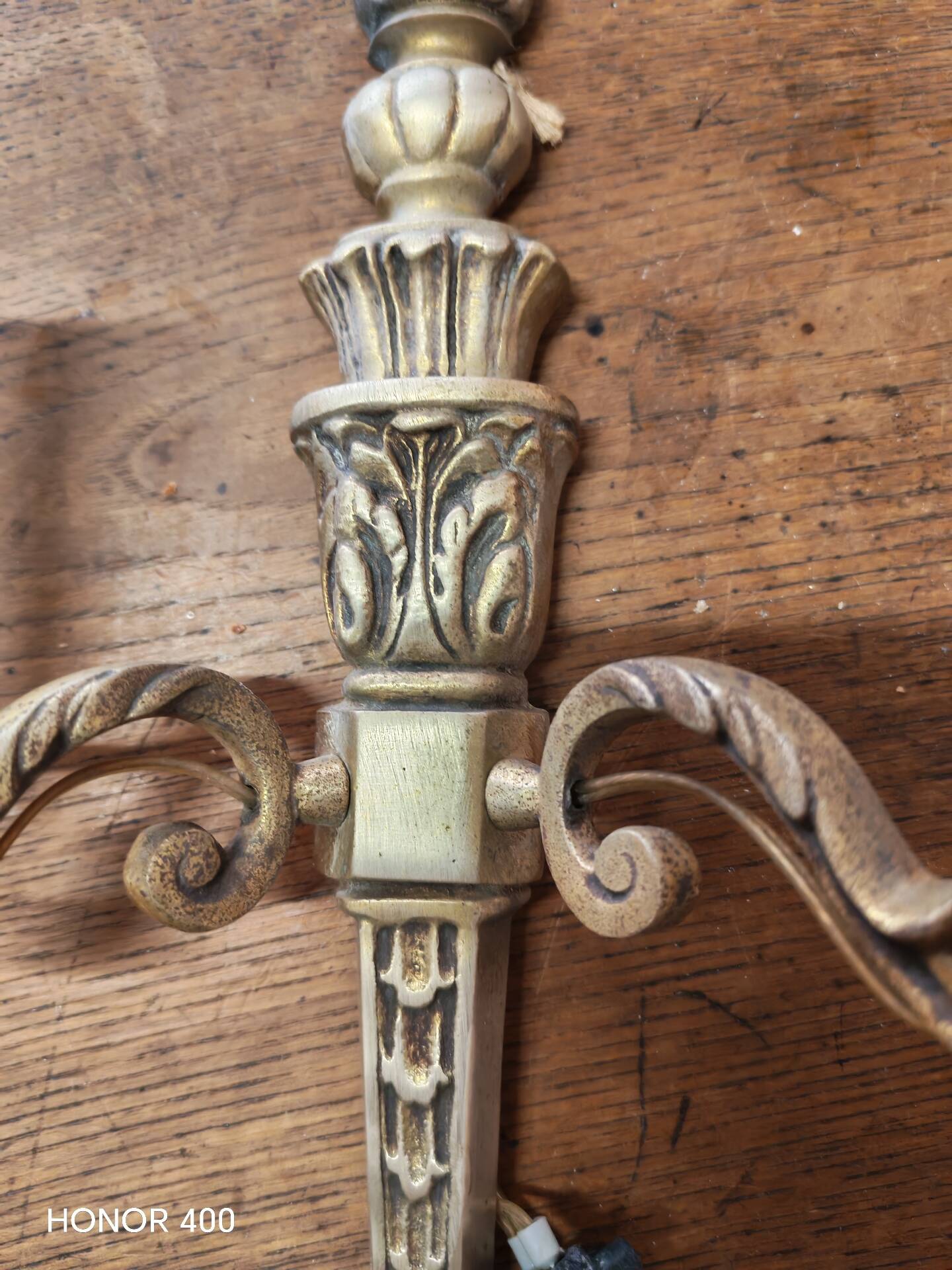 Two antique wall sconces in gilded bronze in the Louis XVI style.