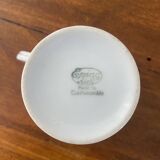 White porcelain flowered cup and saucer