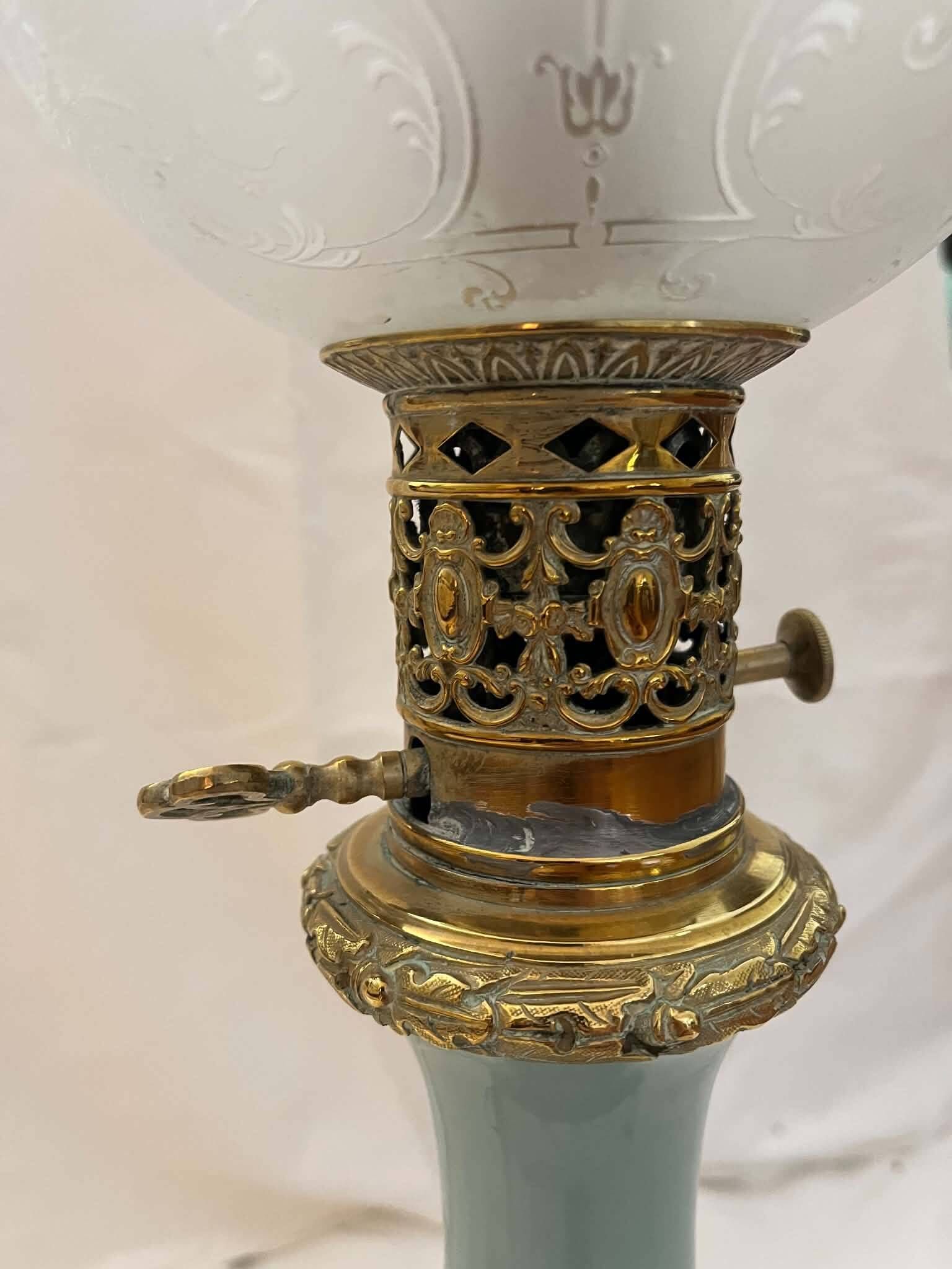 Oil lamp in celadon and bronze with its original glass globe, 19th century.