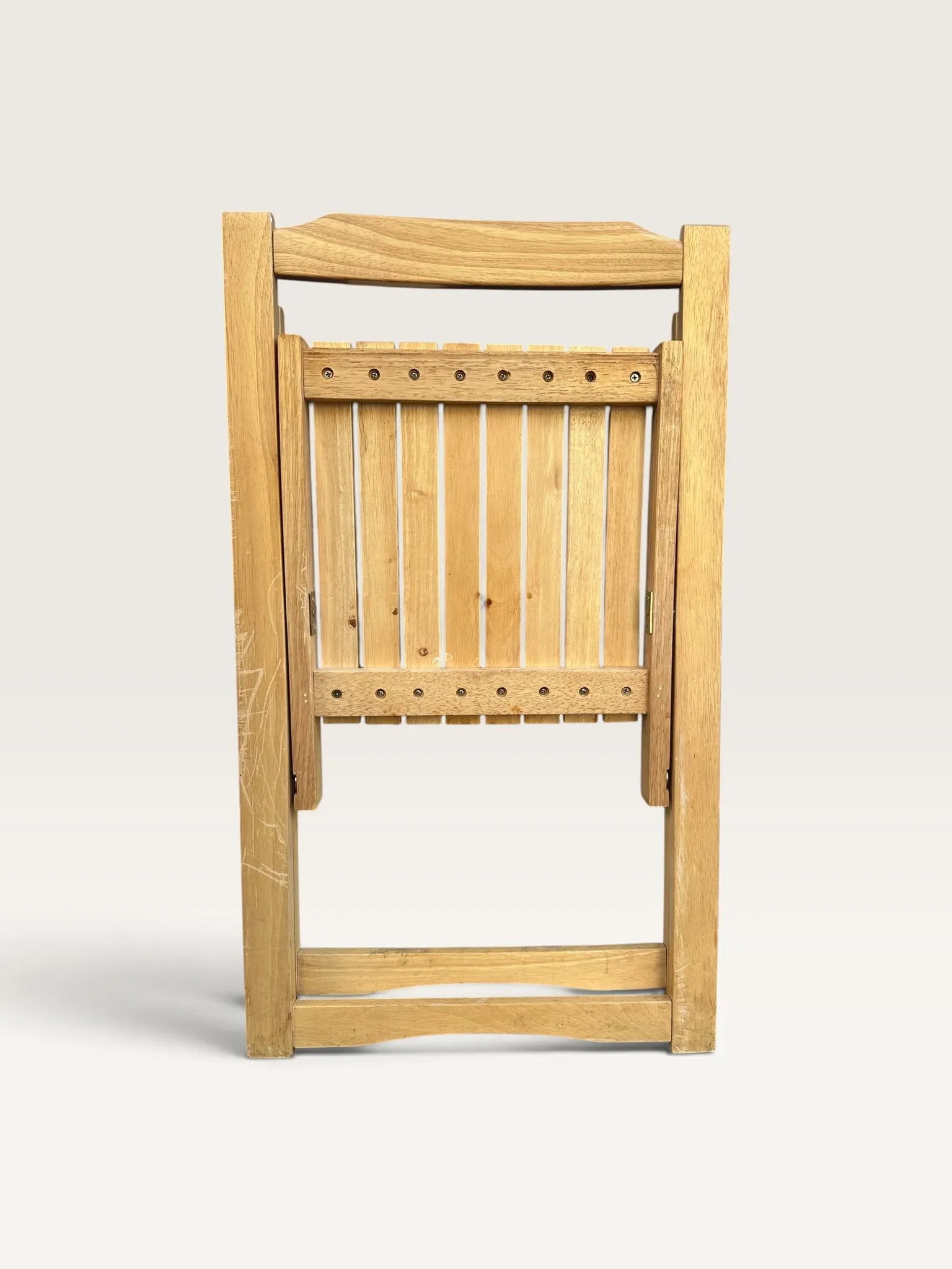 Blonde wooden folding chair in the style of Aldo Jacober.