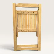 Blonde wooden folding chair in the style of Aldo Jacober.