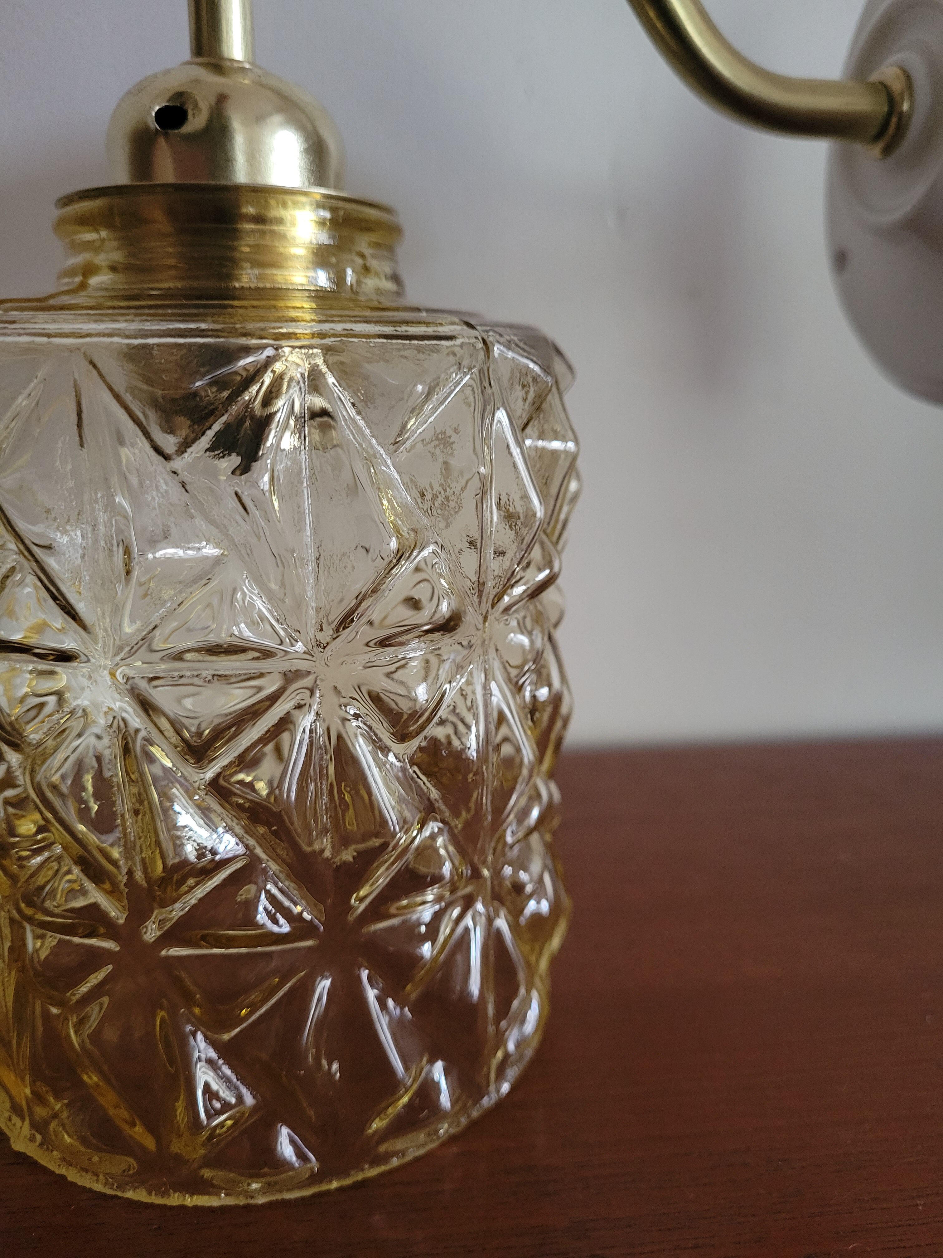 Brass wall lamp and molded glass