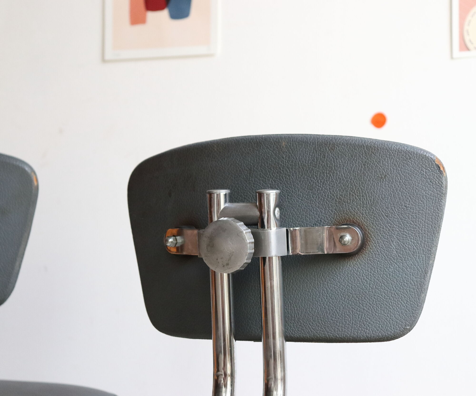 Pair of workshop chairs from the 50s in chrome steel and imitation leather