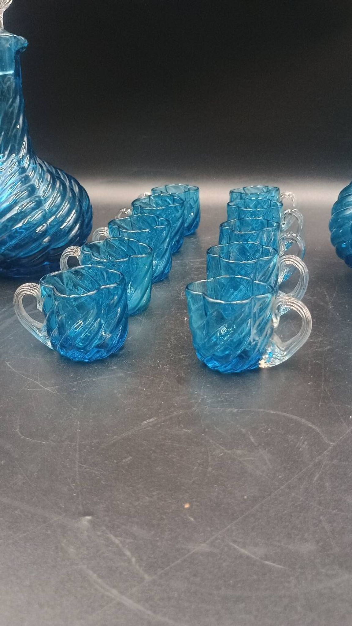 Cabaret Portieux liqueur service with 10 blue and clear glasses.