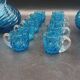 Cabaret Portieux liqueur service with 10 blue and clear glasses.