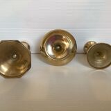 Trio of brass candle holders