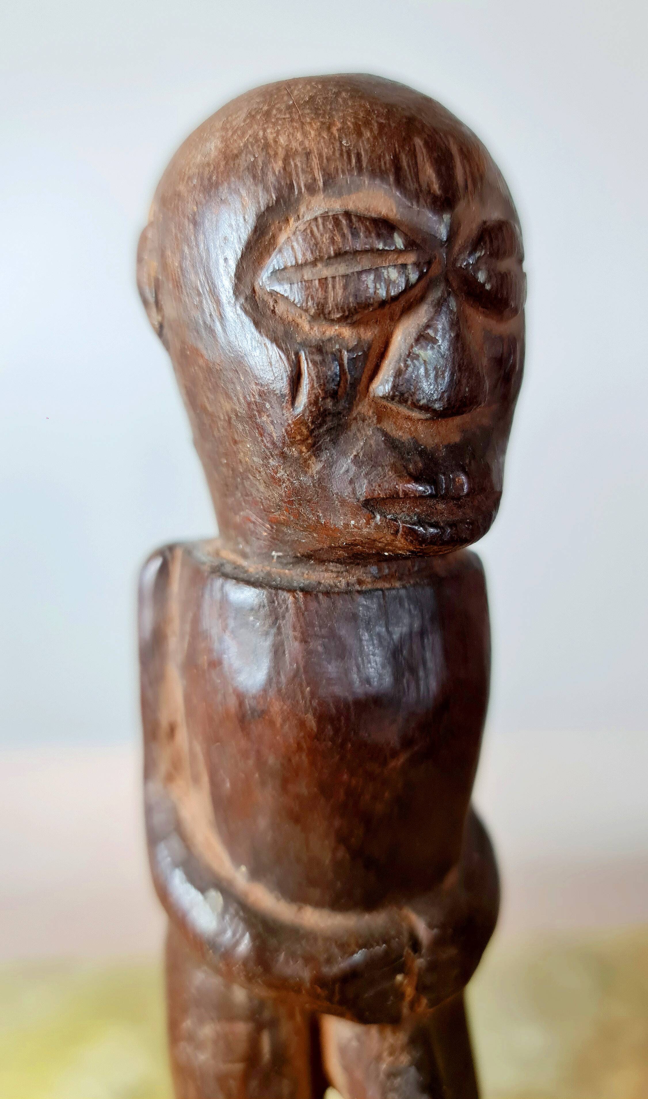 Old Fon statuette on a base, Benin