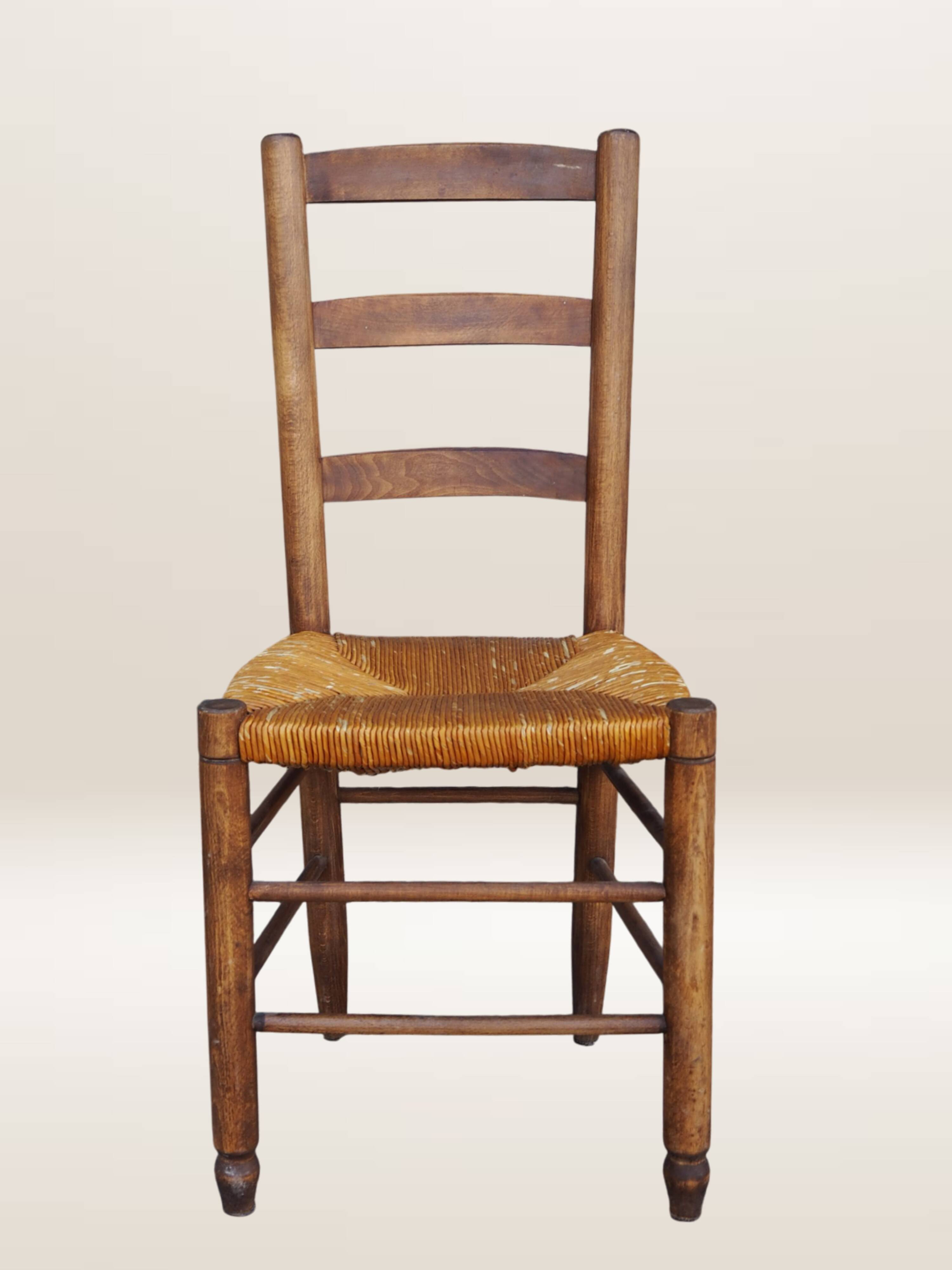Set of six rush-seated ladderback chairs.