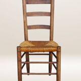 Set of six rush-seated ladderback chairs.