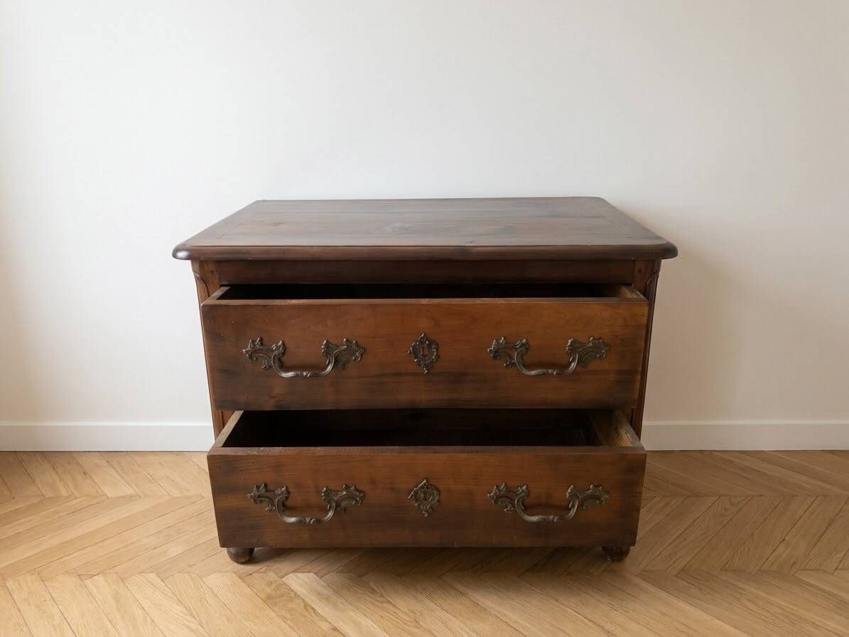 Antique walnut chest of drawers with two drawers.
