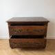 Antique walnut chest of drawers with two drawers.