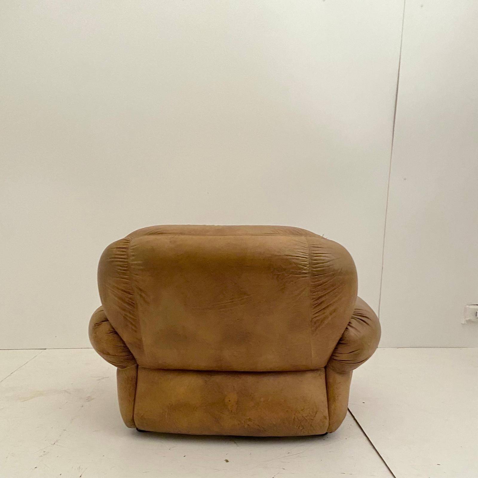 Pair of brown leather armchairs