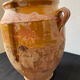 Old grease pot in glazed yellow terracotta, France nineteenth century