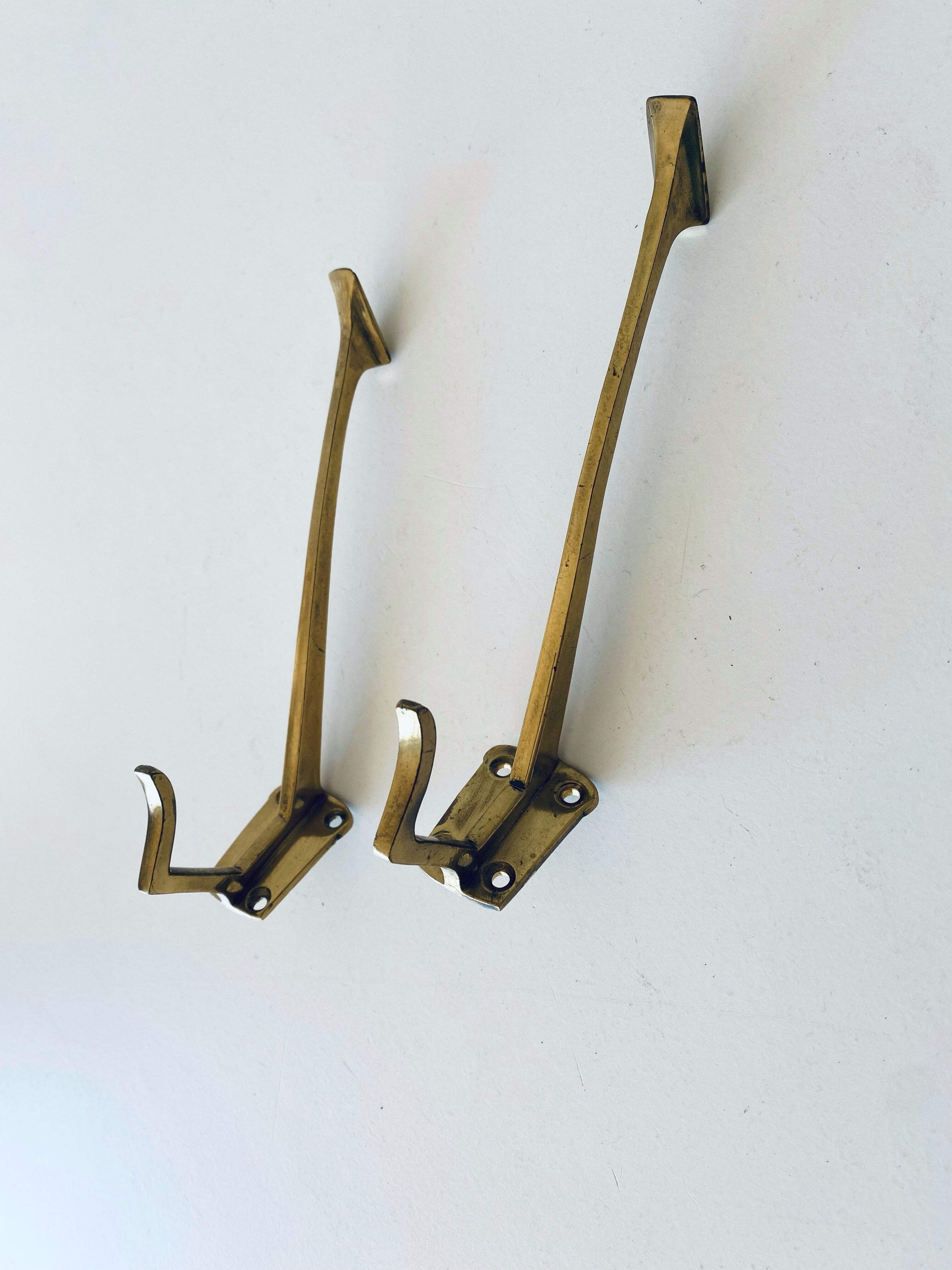 Pair of vintage brass hooks