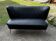 Mid-century black vinyl cocktail canapé with beech legs, 1950s two-seater bench.