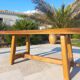 Rustic handcrafted coffee table with a mahogany top and elm legs.