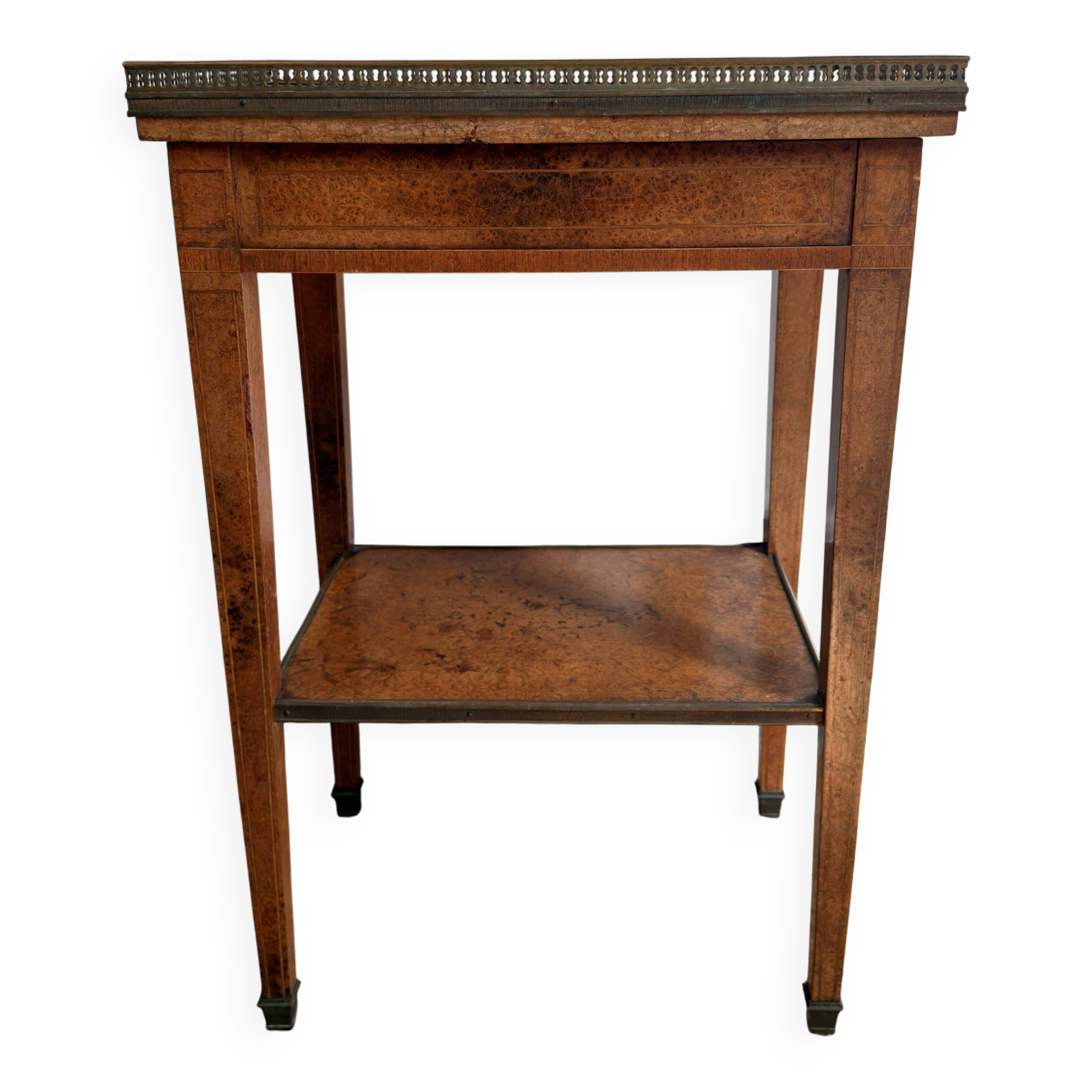 Occasional table in walnut burl and brass gallery.